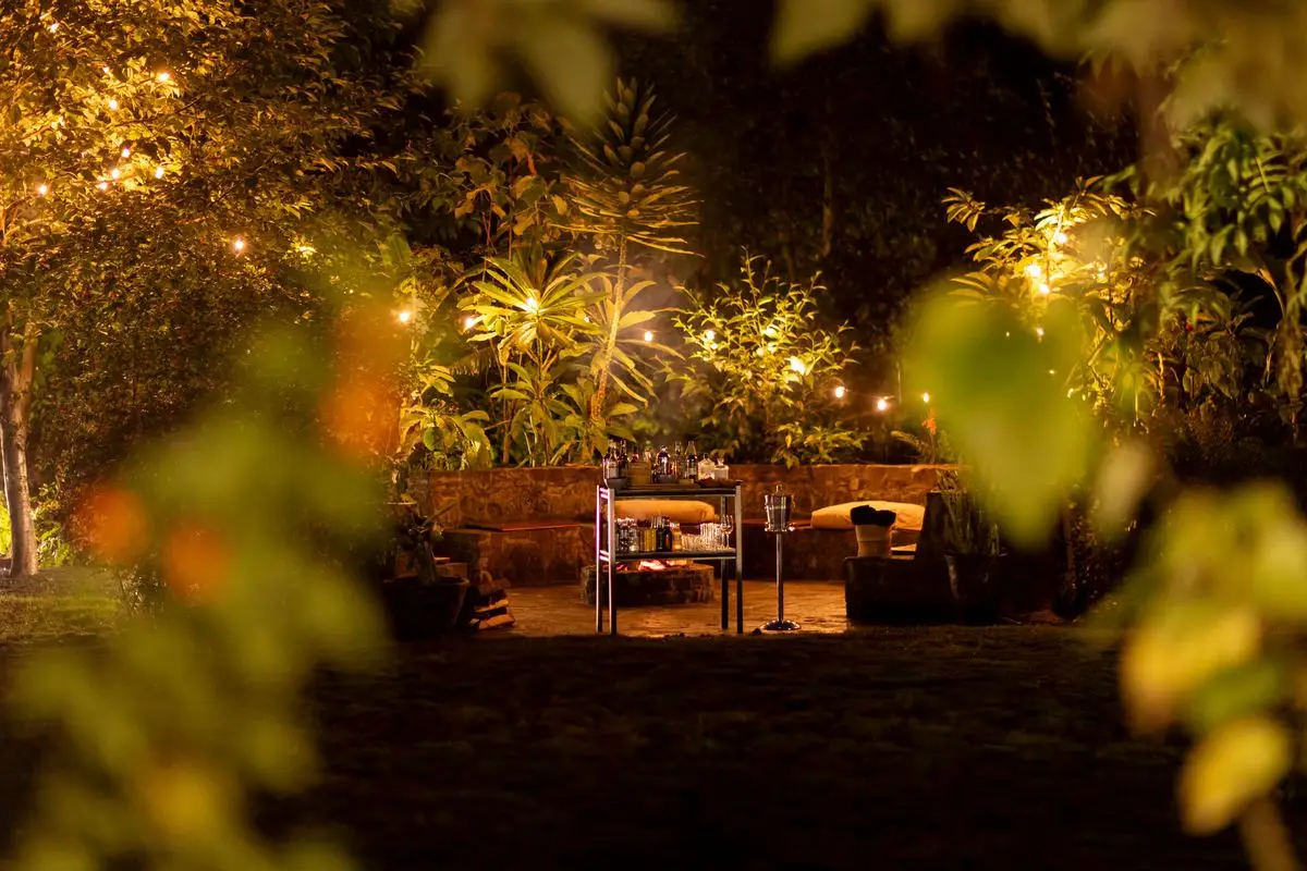 Garden seating in the evening at Sambora Kinigi